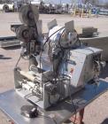 Used Labeling Systems Inc (LSI) Semi Automatic Wrap Around Labeler, Model 301S. Designed for semi automatic wrap around labeling of products such as bottles, vials or cans. Maximum bottle size 12