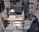 Used Labeling Systems Inc (LSI) Semi Automatic Wrap Around Labeler, Model 301S. Designed for semi automatic wrap around labeling of products such as bottles, vials or cans. Maximum bottle size 12