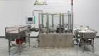 Used Neri Pressure Sensitive Trunion Wraparound Vial/Ampoule Labeler