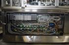 Used Neri Pressure Sensitive Trunion Wraparound Vial/Ampoule Labeler