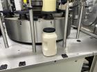 Gebraucht - P.E. Master Automatischer rotierender druckempfindlicher Etikettierer mit Behälterregistrierung. Verfügt über re...
