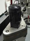Used Quadrel model Q60 Wraparound Pressure Sensitive Labeler with Norwood Hot Stamp Coder. Has a 7