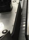 Used Quadrel model Q60 Wraparound Pressure Sensitive Labeler with Norwood Hot Stamp Coder. Has a 7