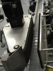 Used Quadrel model Q60 Wraparound Pressure Sensitive Labeler with Norwood Hot Stamp Coder. Has a 7