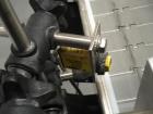 Used Quadrel model Q60 Wraparound Pressure Sensitive Labeler with Norwood Hot Stamp Coder. Has a 7