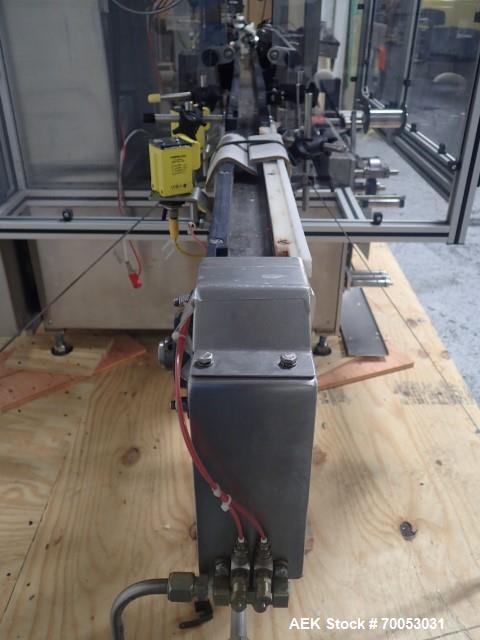 Used-Used PDC neck bander sleever, model 75E, speeds up to 300 containers/minute, .375 - 3.5" diameter, .625 - 9" high band ...