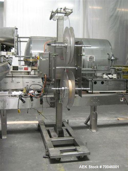 Used Axon "Styrotech" Sleeve Labeler or Tamper Evident Band Applicator, EZ-200 Series, Serial# E0201106. Machine is a single head design and can perform at up to 120 containers per minute. This machi...
