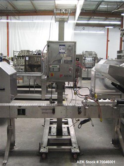Used Axon "Styrotech" Sleeve Labeler or Tamper Evident Band Applicator, EZ-200 Series, Serial# E0201106. Machine is a single head design and can perform at up to 120 containers per minute. This machi...