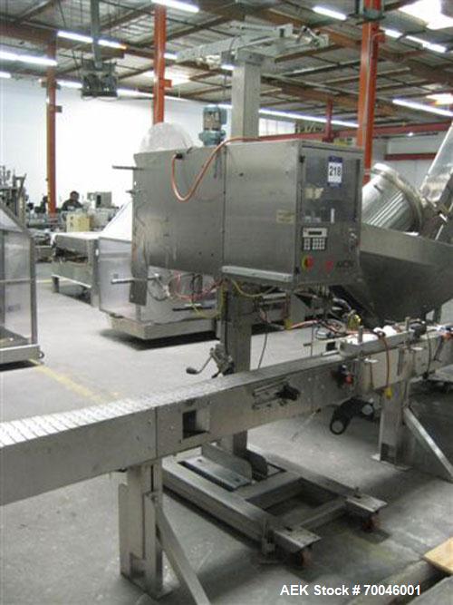 Used Axon "Styrotech" Sleeve Labeler or Tamper Evident Band Applicator, EZ-200 Series, Serial# E0201106. Machine is a single head design and can perform at up to 120 containers per minute. This machi...