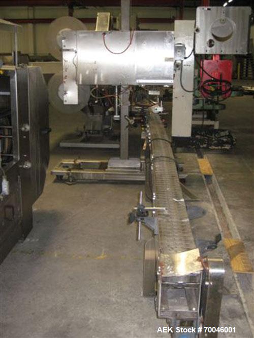 Used Axon "Styrotech" Sleeve Labeler or Tamper Evident Band Applicator, EZ-200 Series, Serial# E0201106. Machine is a single head design and can perform at up to 120 containers per minute. This machi...