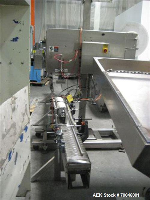 Used Axon "Styrotech" Sleeve Labeler or Tamper Evident Band Applicator, EZ-200 Series, Serial# E0201106. Machine is a single head design and can perform at up to 120 containers per minute. This machi...