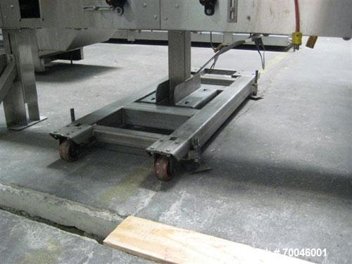 Used Axon "Styrotech" Sleeve Labeler or Tamper Evident Band Applicator, EZ-200 Series, Serial# E0201106. Machine is a single head design and can perform at up to 120 containers per minute. This machi...