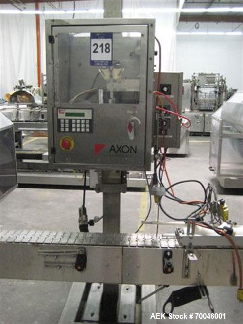Used Axon "Styrotech" Sleeve Labeler or Tamper Evident Band Applicator, EZ-200 Series, Serial# E0201106. Machine is a single head design and can perform at up to 120 containers per minute. This machi...
