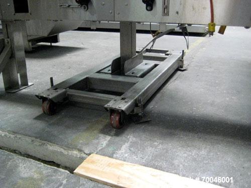 Used Axon "Styrotech" Sleeve Labeler or Tamper Evident Band Applicator, EZ-200 Series, Serial# E0201106. Machine is a single head design and can perform at up to 120 containers per minute. This machi...