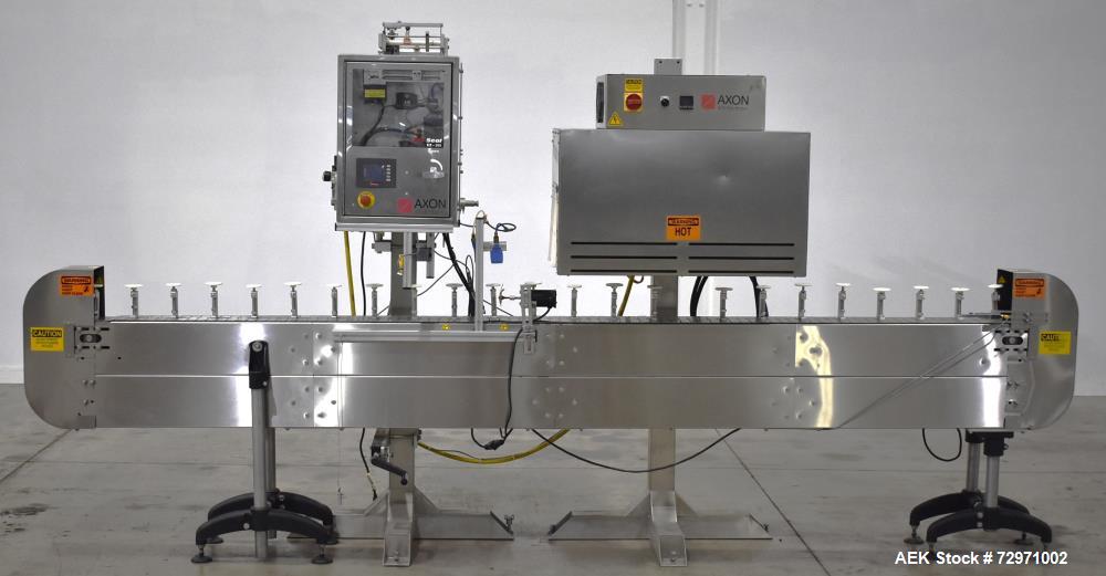 Used Axon Styrotech EZ-Seal EZ-200 Single Head Tamper Evident Neck Bander. Designed to run up to 120 containers per minute. 1-60/115 volt, 10 amp, serial # T-100210B, built 05/2010. Includes a heat s...