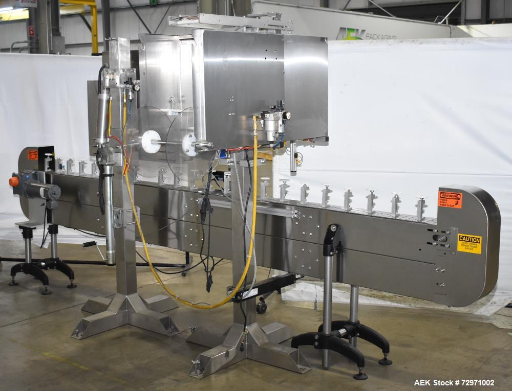 Used Axon Styrotech EZ-Seal EZ-200 Single Head Tamper Evident Neck Bander. Designed to run up to 120 containers per minute. 1-60/115 volt, 10 amp, serial # T-100210B, built 05/2010. Includes a heat s...