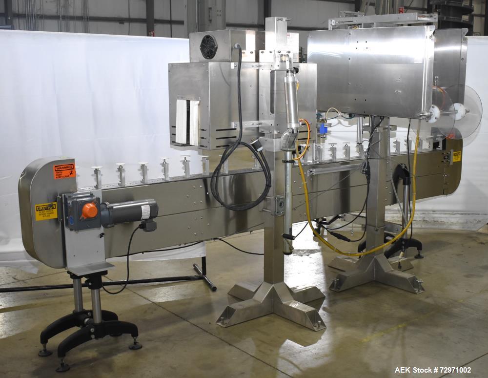 Used Axon Styrotech EZ-Seal EZ-200 Single Head Tamper Evident Neck Bander. Designed to run up to 120 containers per minute. 1-60/115 volt, 10 amp, serial # T-100210B, built 05/2010. Includes a heat s...
