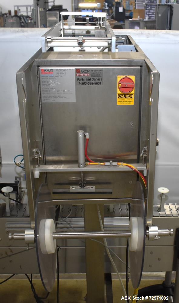 Used Axon Styrotech EZ-Seal EZ-200 Single Head Tamper Evident Neck Bander. Designed to run up to 120 containers per minute. 1-60/115 volt, 10 amp, serial # T-100210B, built 05/2010. Includes a heat s...