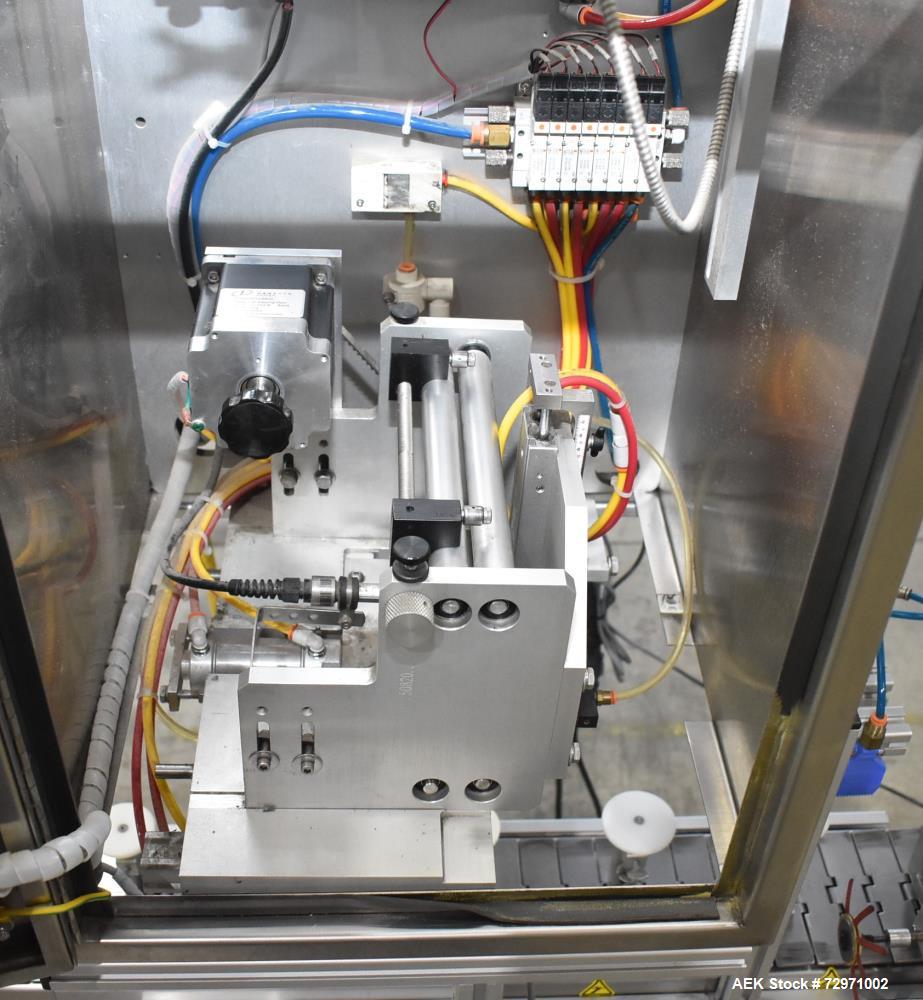 Used Axon Styrotech EZ-Seal EZ-200 Single Head Tamper Evident Neck Bander. Designed to run up to 120 containers per minute. 1-60/115 volt, 10 amp, serial # T-100210B, built 05/2010. Includes a heat s...