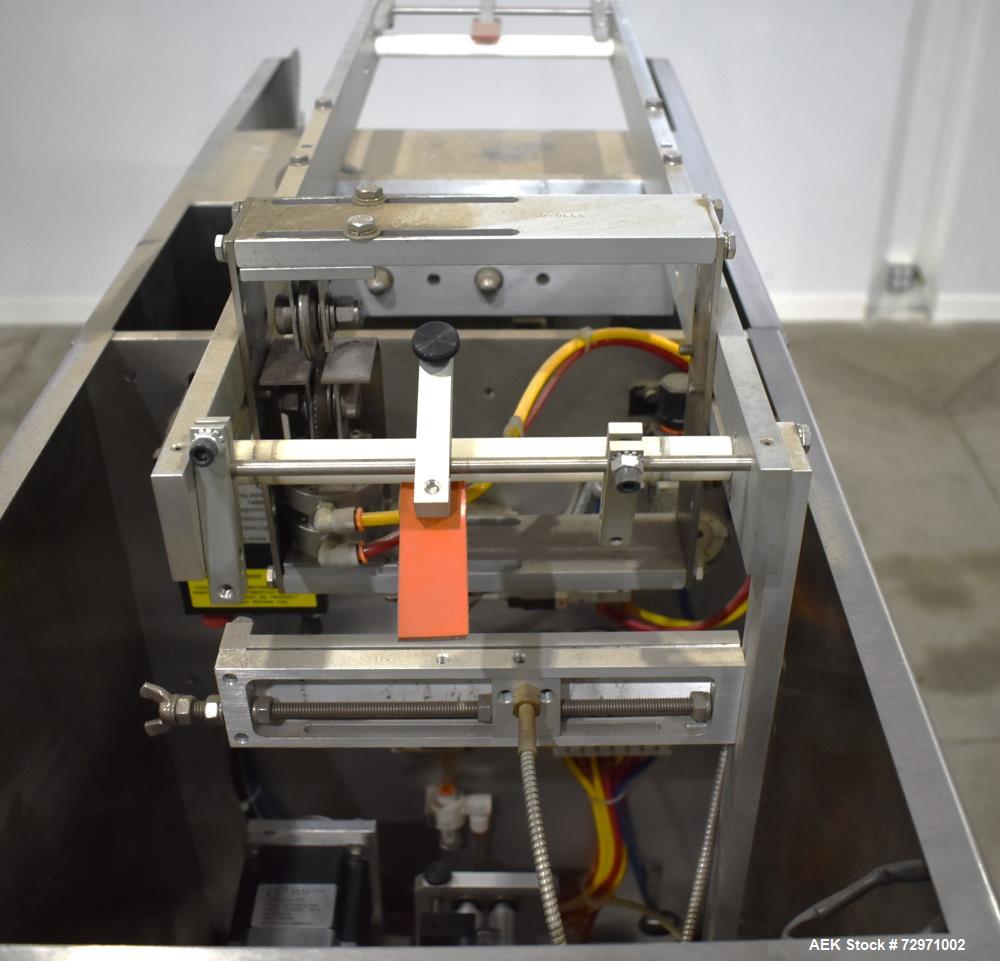 Used Axon Styrotech EZ-Seal EZ-200 Single Head Tamper Evident Neck Bander. Designed to run up to 120 containers per minute. 1-60/115 volt, 10 amp, serial # T-100210B, built 05/2010. Includes a heat s...