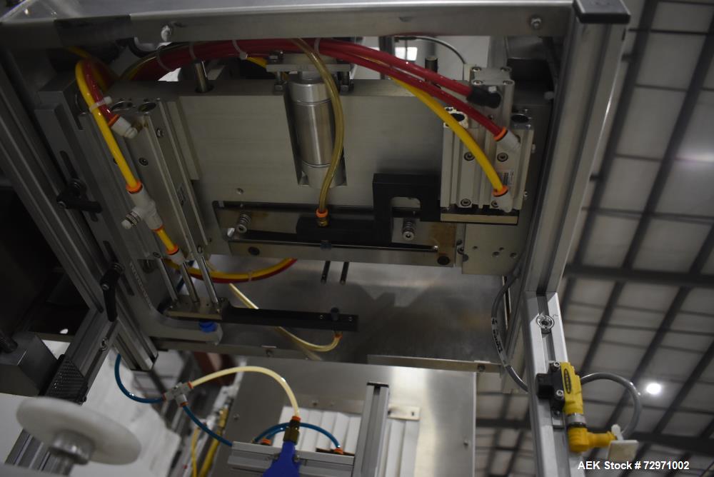 Used Axon Styrotech EZ-Seal EZ-200 Single Head Tamper Evident Neck Bander. Designed to run up to 120 containers per minute. 1-60/115 volt, 10 amp, serial # T-100210B, built 05/2010. Includes a heat s...