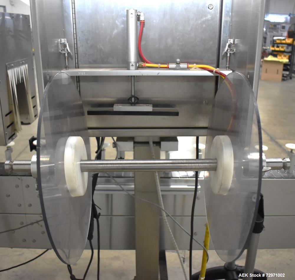 Used Axon Styrotech EZ-Seal EZ-200 Single Head Tamper Evident Neck Bander. Designed to run up to 120 containers per minute. 1-60/115 volt, 10 amp, serial # T-100210B, built 05/2010. Includes a heat s...