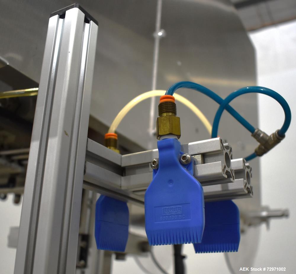 Used Axon Styrotech EZ-Seal EZ-200 Single Head Tamper Evident Neck Bander. Designed to run up to 120 containers per minute. 1-60/115 volt, 10 amp, serial # T-100210B, built 05/2010. Includes a heat s...