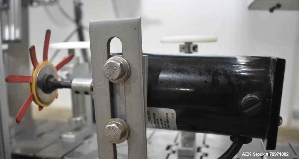 Used Axon Styrotech EZ-Seal EZ-200 Single Head Tamper Evident Neck Bander. Designed to run up to 120 containers per minute. 1-60/115 volt, 10 amp, serial # T-100210B, built 05/2010. Includes a heat s...