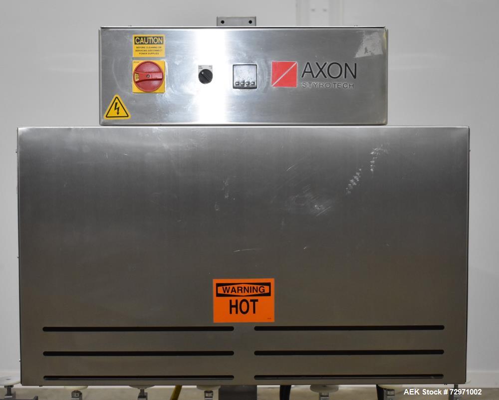 Used Axon Styrotech EZ-Seal EZ-200 Single Head Tamper Evident Neck Bander. Designed to run up to 120 containers per minute. 1-60/115 volt, 10 amp, serial # T-100210B, built 05/2010. Includes a heat s...