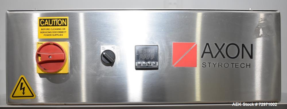 Used Axon Styrotech EZ-Seal EZ-200 Single Head Tamper Evident Neck Bander. Designed to run up to 120 containers per minute. 1-60/115 volt, 10 amp, serial # T-100210B, built 05/2010. Includes a heat s...