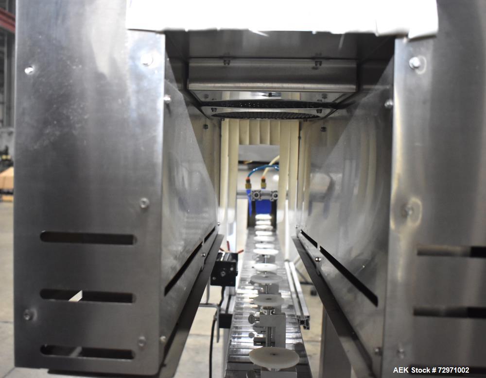 Used Axon Styrotech EZ-Seal EZ-200 Single Head Tamper Evident Neck Bander. Designed to run up to 120 containers per minute. 1-60/115 volt, 10 amp, serial # T-100210B, built 05/2010. Includes a heat s...