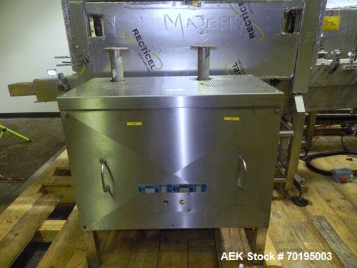 Used- Graham Packaging RF200LRSleeve Labeler. Capable of speeds up to 200 bottles per minute. Sleeve layflat range of 30mm -...