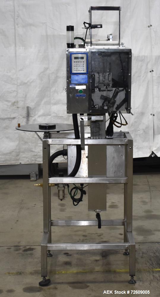 Used Marburg Industries Model M-725-FB Auto Cap Sealer. Approximate speeds up to 200 units per minute. Approximate bands up to a 70mm closure. Has Mitsubishi MELSEC PLC, Mitsubishi drive. Serial# 165...
