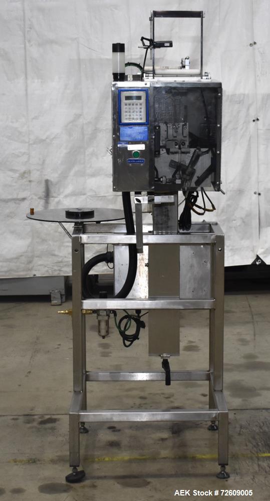 Used- Marburg Industries Model M-725-FB Auto Cap Sealer. Approximate speeds up to 200 units per minute. Approximate bands up...