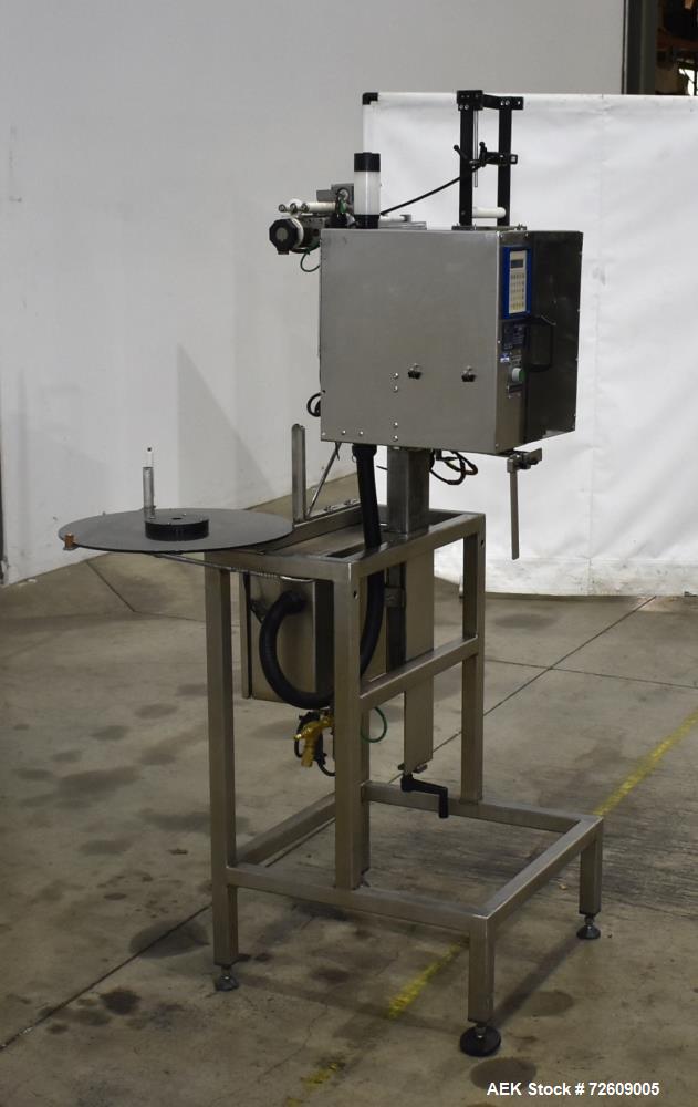 Used Marburg Industries Model M-725-FB Auto Cap Sealer. Approximate speeds up to 200 units per minute. Approximate bands up to a 70mm closure. Has Mitsubishi MELSEC PLC, Mitsubishi drive. Serial# 165...