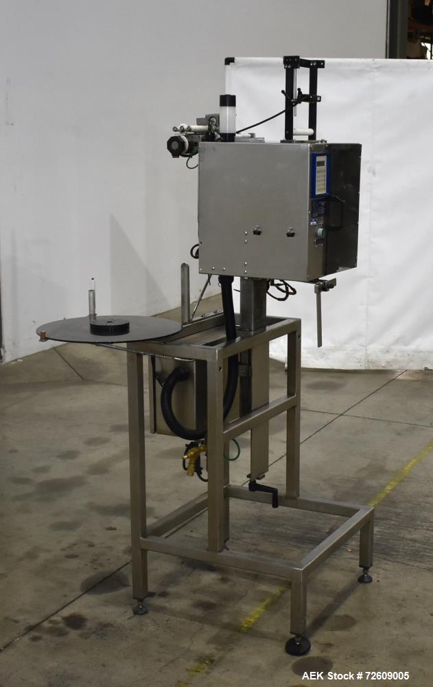 Used- Marburg Industries Model M-725-FB Auto Cap Sealer. Approximate speeds up to 200 units per minute. Approximate bands up...