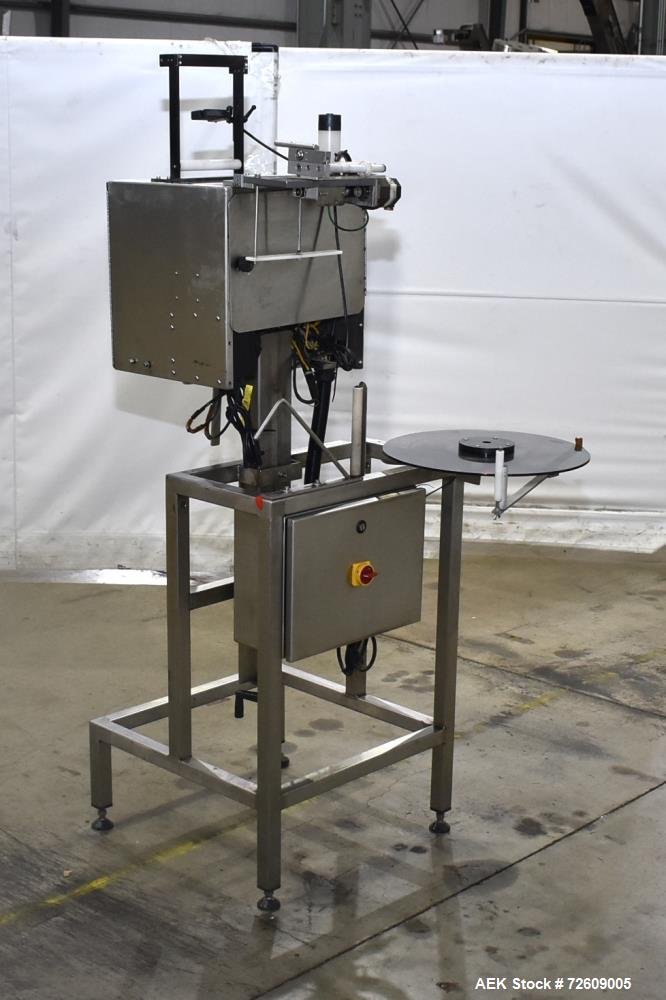 Used Marburg Industries Model M-725-FB Auto Cap Sealer. Approximate speeds up to 200 units per minute. Approximate bands up to a 70mm closure. Has Mitsubishi MELSEC PLC, Mitsubishi drive. Serial# 165...