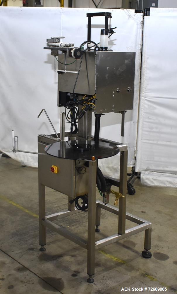 Used Marburg Industries Model M-725-FB Auto Cap Sealer. Approximate speeds up to 200 units per minute. Approximate bands up to a 70mm closure. Has Mitsubishi MELSEC PLC, Mitsubishi drive. Serial# 165...