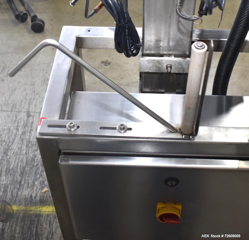 Used Marburg Industries Model M-725-FB Auto Cap Sealer. Approximate speeds up to 200 units per minute. Approximate bands up to a 70mm closure. Has Mitsubishi MELSEC PLC, Mitsubishi drive. Serial# 165...