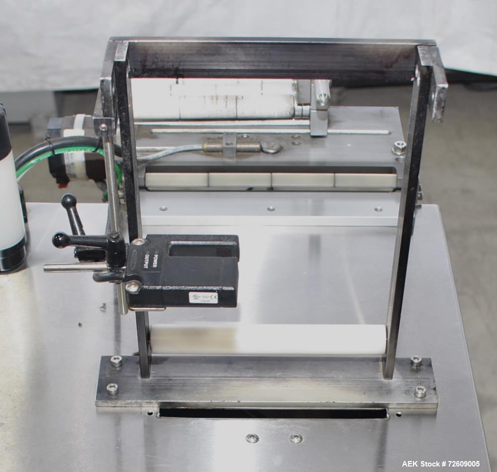 Used Marburg Industries Model M-725-FB Auto Cap Sealer. Approximate speeds up to 200 units per minute. Approximate bands up to a 70mm closure. Has Mitsubishi MELSEC PLC, Mitsubishi drive. Serial# 165...