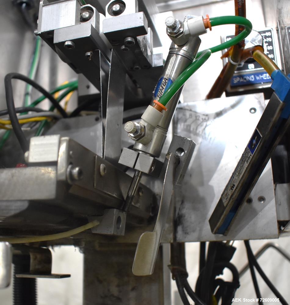 Used Marburg Industries Model M-725-FB Auto Cap Sealer. Approximate speeds up to 200 units per minute. Approximate bands up to a 70mm closure. Has Mitsubishi MELSEC PLC, Mitsubishi drive. Serial# 165...