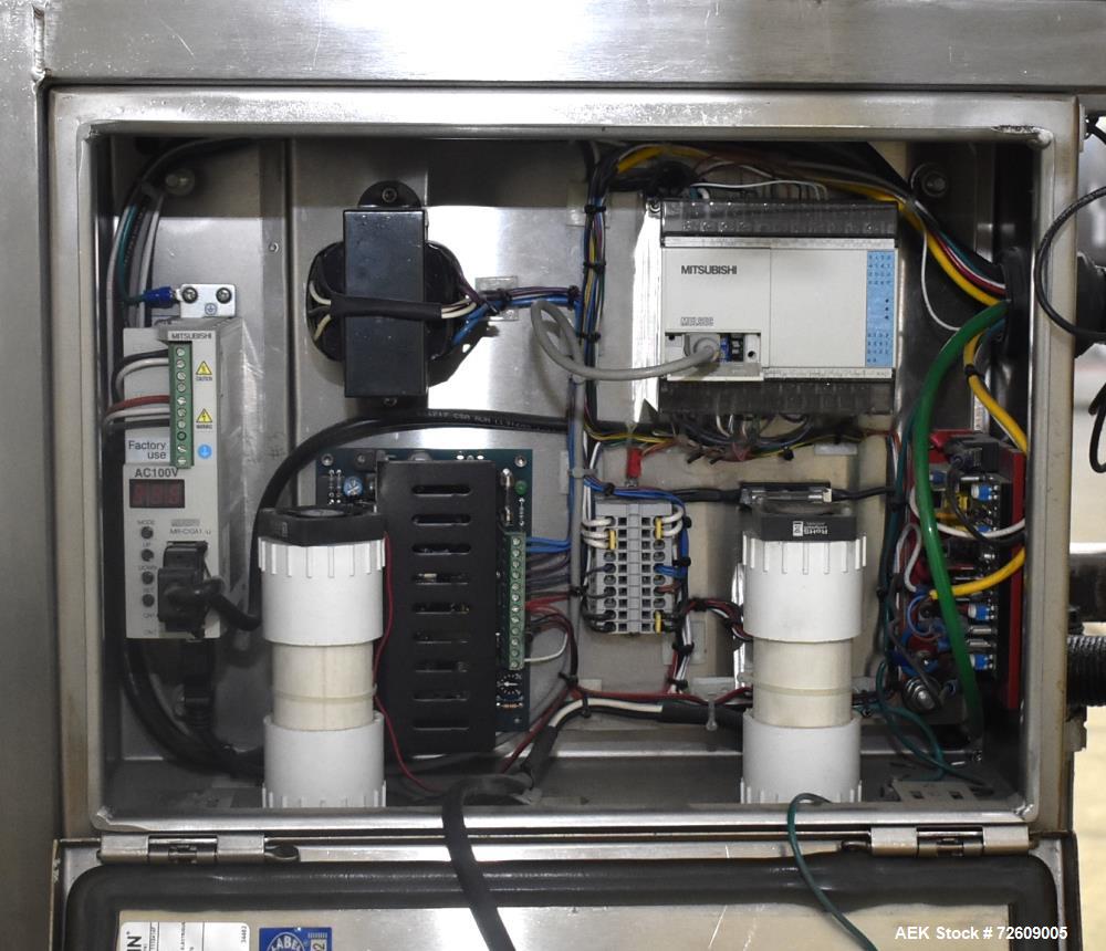 Used Marburg Industries Model M-725-FB Auto Cap Sealer. Approximate speeds up to 200 units per minute. Approximate bands up to a 70mm closure. Has Mitsubishi MELSEC PLC, Mitsubishi drive. Serial# 165...