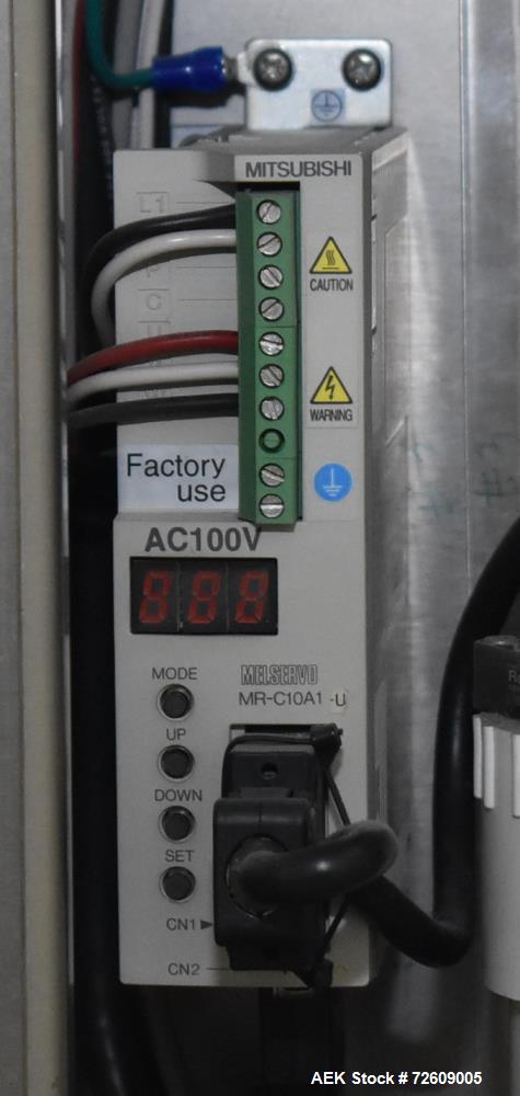 Used Marburg Industries Model M-725-FB Auto Cap Sealer. Approximate speeds up to 200 units per minute. Approximate bands up to a 70mm closure. Has Mitsubishi MELSEC PLC, Mitsubishi drive. Serial# 165...