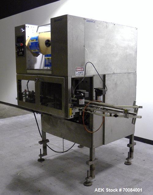 Used SleeveCo Automatic Sleeve Label Machine, Model SL-3000. Capable of speeds up to 50 containers per minute. Maximum size 2-1/2 gallon containers and currently set up on a one gallon round sleeve l...