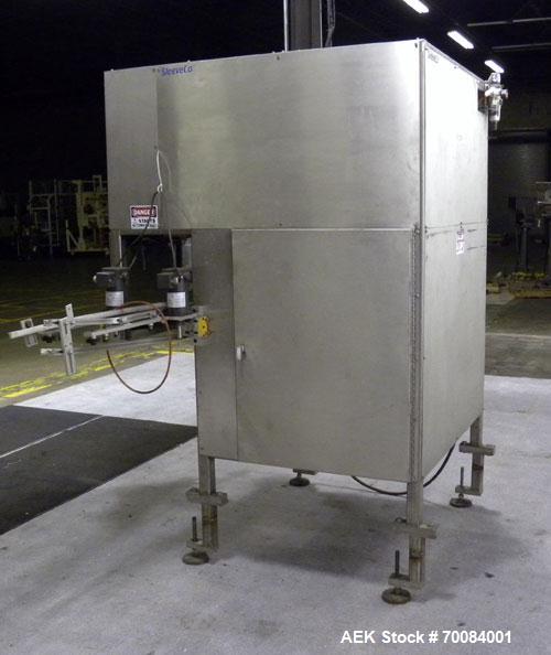 Used SleeveCo Automatic Sleeve Label Machine, Model SL-3000. Capable of speeds up to 50 containers per minute. Maximum size 2-1/2 gallon containers and currently set up on a one gallon round sleeve l...