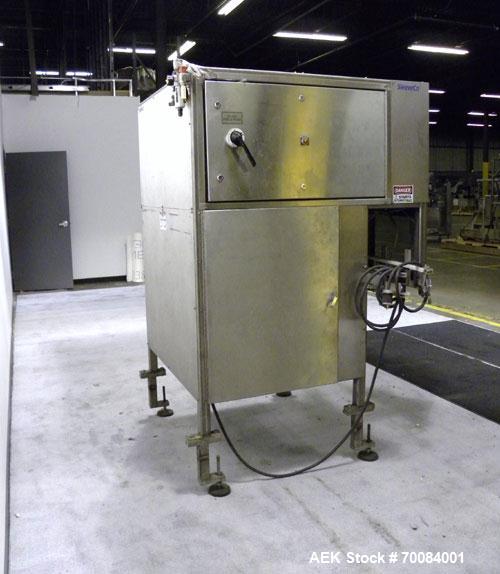 Used SleeveCo Automatic Sleeve Label Machine, Model SL-3000. Capable of speeds up to 50 containers per minute. Maximum size 2-1/2 gallon containers and currently set up on a one gallon round sleeve l...