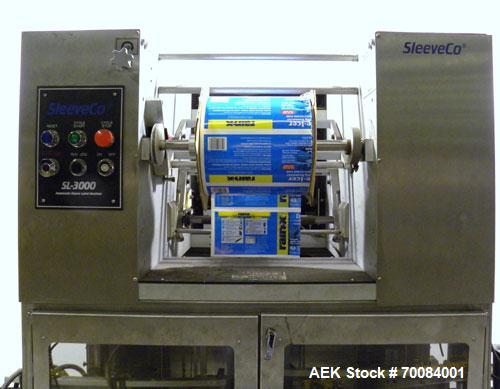 Used SleeveCo Automatic Sleeve Label Machine, Model SL-3000. Capable of speeds up to 50 containers per minute. Maximum size 2-1/2 gallon containers and currently set up on a one gallon round sleeve l...
