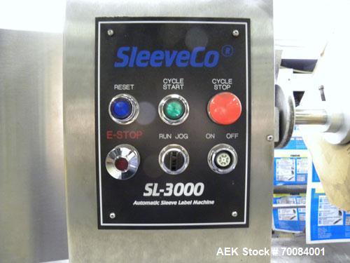 Used SleeveCo Automatic Sleeve Label Machine, Model SL-3000. Capable of speeds up to 50 containers per minute. Maximum size 2-1/2 gallon containers and currently set up on a one gallon round sleeve l...