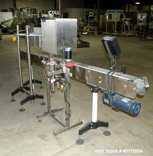 Used Accutek Accusleever Tamper Evident Neck Bander Or Shrink Sleeve Labeler. Capable of speeds up to 60 cpm. Film sizes: Lay flat 16 mm to 150 mm and cut length 16 mm to75 mm. Inclueds a shrink tunn...