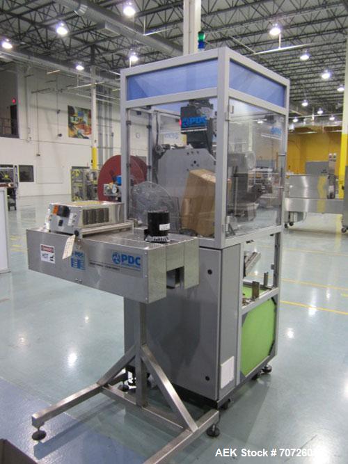 Used PDC Model 60ER shrink sleeve labeler. Capable of speeds from 50 to 130 containers per minute. Sleeve range: (Diam) .375" to 3" or 10mm to 75mm (Height) .625" to 4" or 15mm to 100mm. Has wormscre...